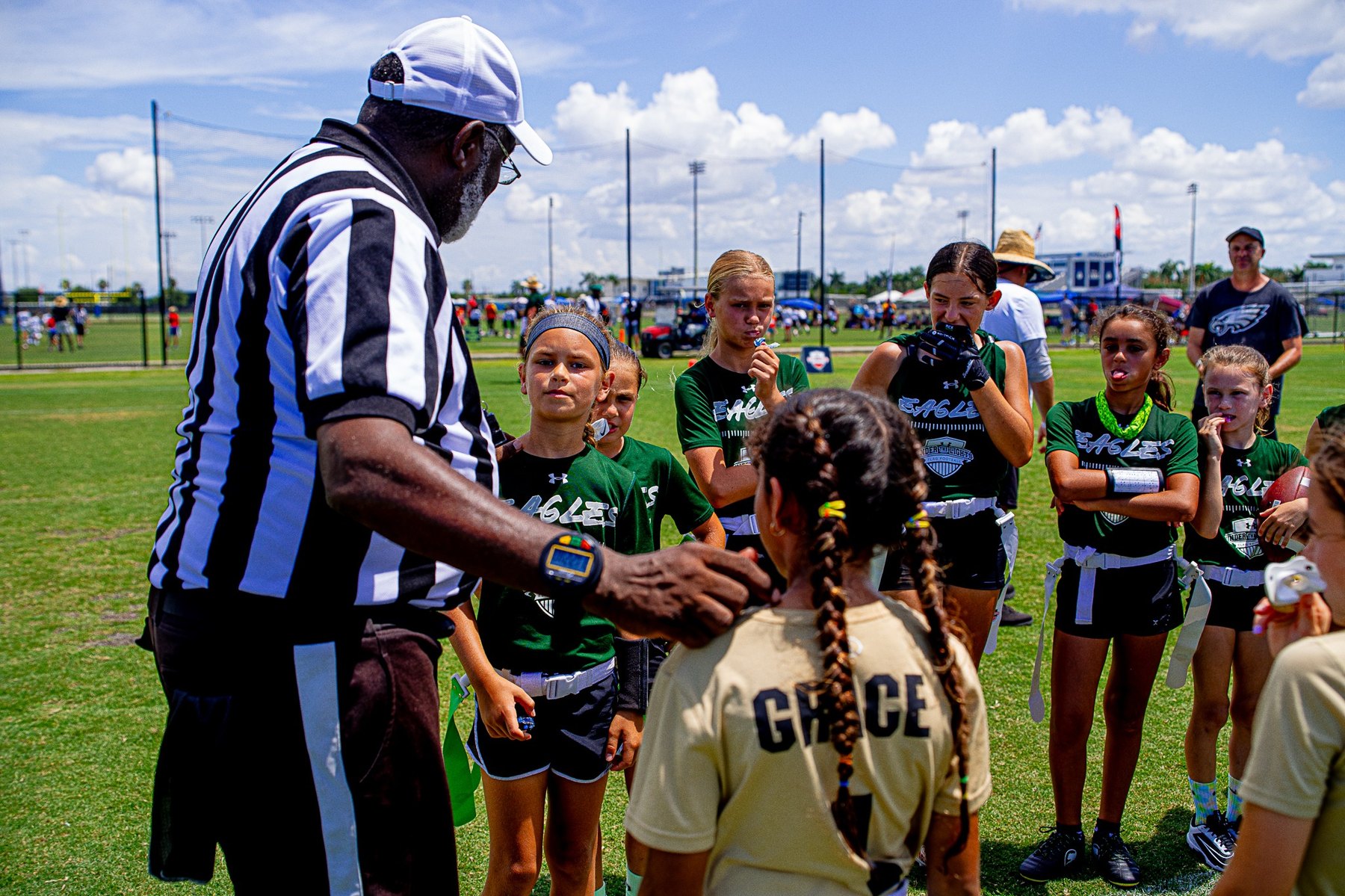 Girls flag football team huddle